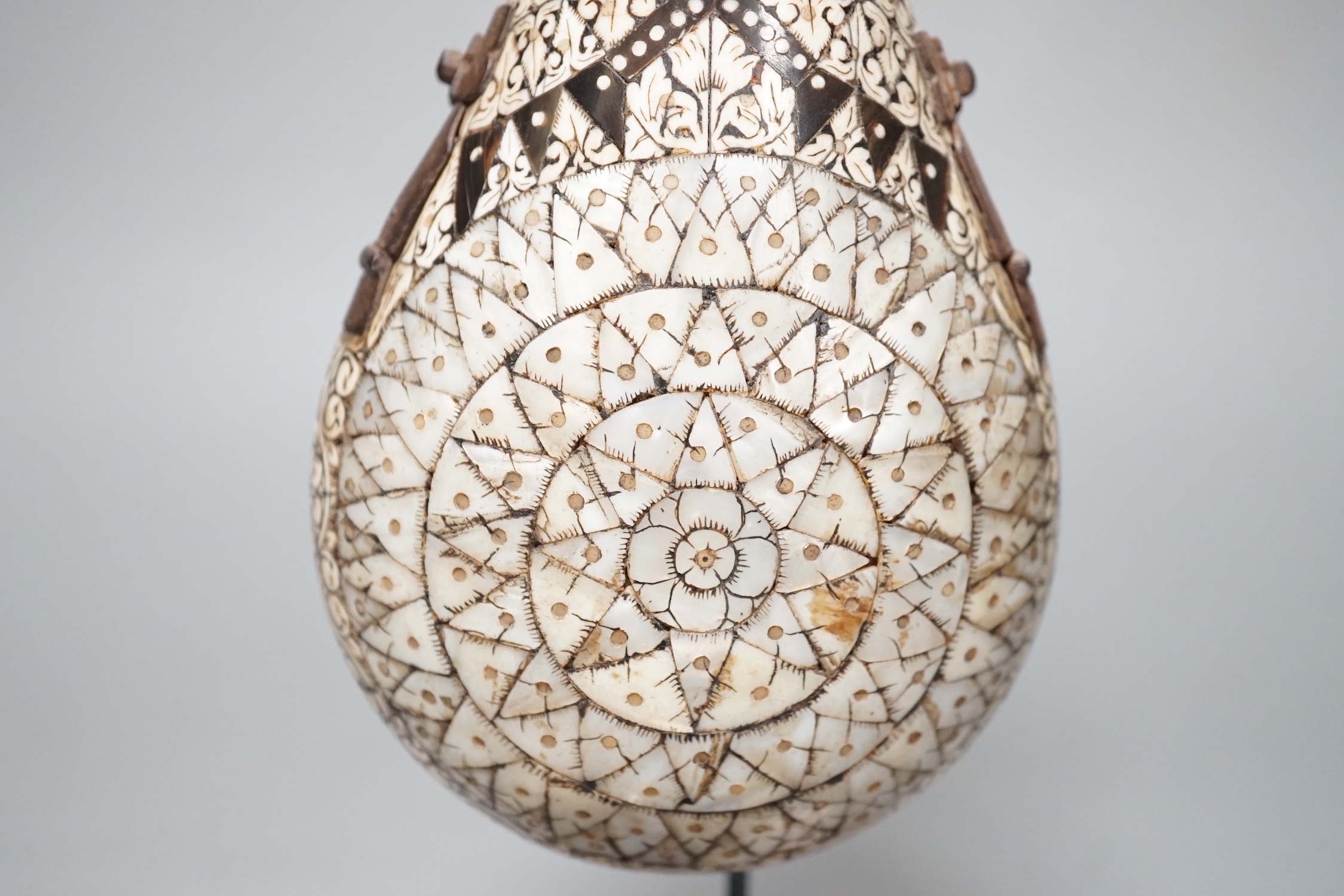 A powder flask, Etawah, India, 19th century, Mother-of-pearl, ivory, horn and black lac on wood - 17cm